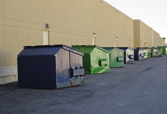 metal waste containers sit at a busy construction site in Boon